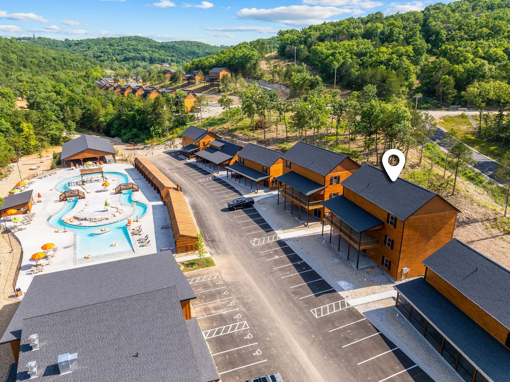 Aerial view of resort vacation community in forested hills