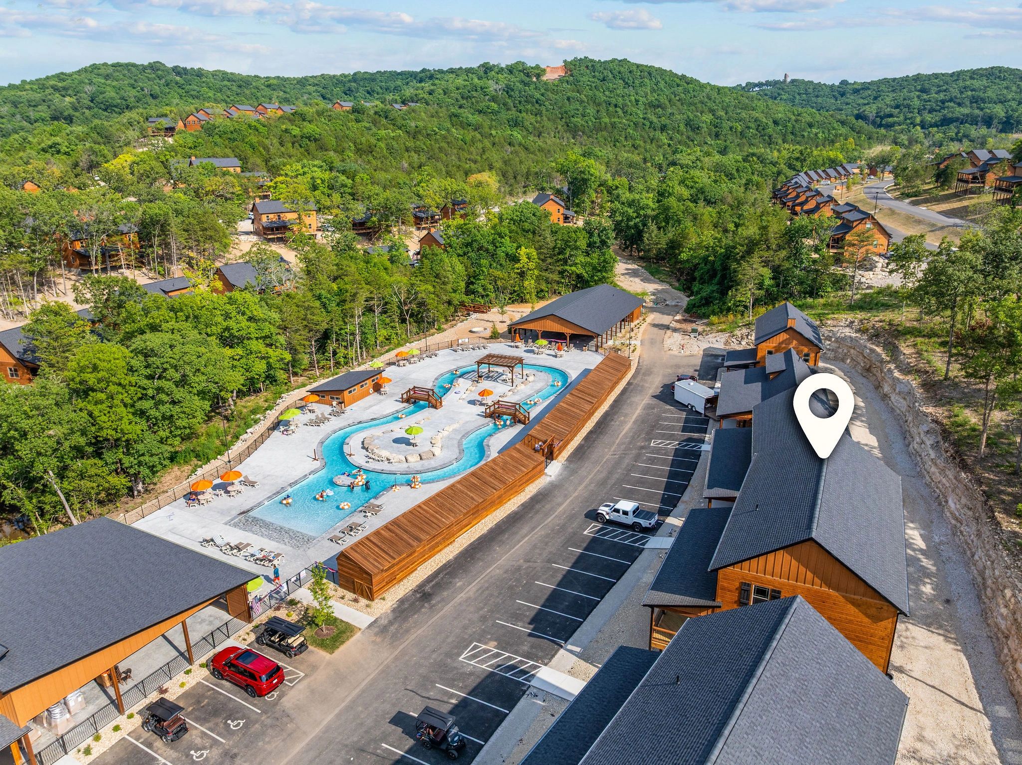 Vacation cabin resort with pool and forested hills